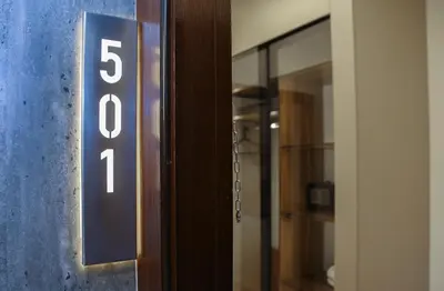 a elevator door with the number on it at Spark Plaza Hotel in Amman