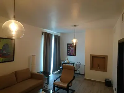 a living room with a couch and a table at The Conroy Boutique Hotel in Amman