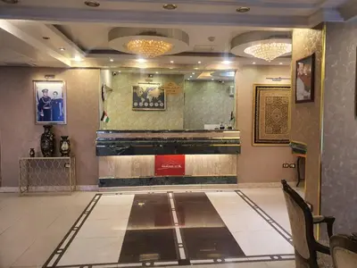 a lobby with a bowling alley in a building at Aghadeer Hotel in Amman