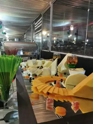 a buffet line of food in a restaurant at Mazayen Rum Camp in Wadi Rum