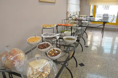 a buffet of food on display in a room at Capri Hotel Suites in Amman