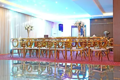 a conference room with a long table and chairs at Lijam Hotel in Amman