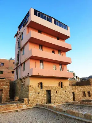 a tall building sitting on top of a brick wall at Orient Gate in Wadi Musa