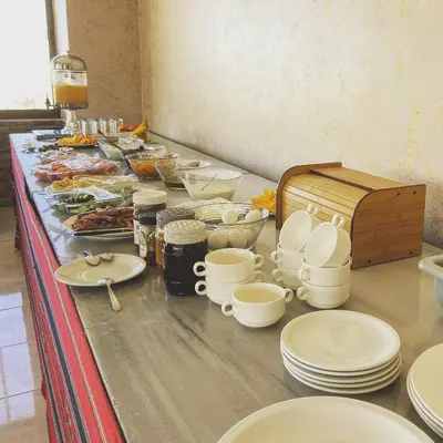 a buffet with plates and dishes on a table at Anbat Midtown Hotel in Wadi Musa