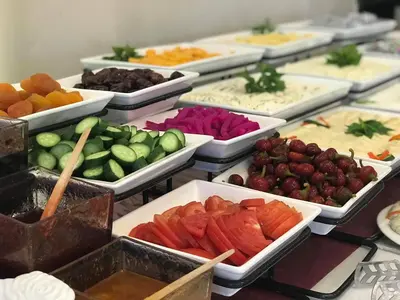 a buffet of different types of fruits and vegetables at Virginia Hotel in Amman