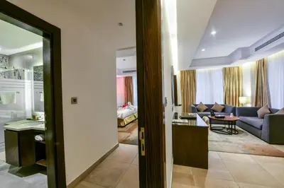 a living room with a couch and a table at Downtown Hotel Apartments in Amman