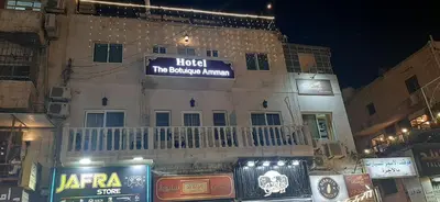 a building with a sign on the side of it at The Boutique Hotel Amman in Amman