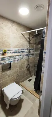 a bathroom with a toilet and a shower at The Boutique Hotel Amman in Amman