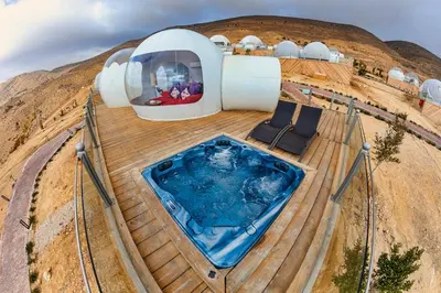 a house on a hill with a swimming pool at Petra Bubble Luxotel in Wadi Musa