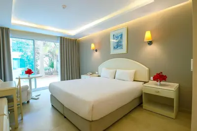 a hotel room with a bed and a window at Petra Palace Hotel in Wadi Musa