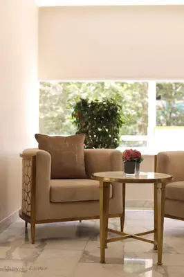 a living room with a couch and a table at The SanRock Hotel in Amman
