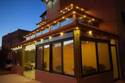 a building with lights on the side of it at Petra Sky Hotel in Wadi Musa