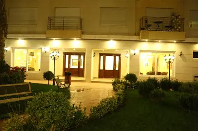 a house with lights on the front of it at Western Gate Residence 2 Amman in Amman