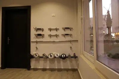 a room with a wall with four shelves and a window at Western Gate Residence 2 Amman in Amman