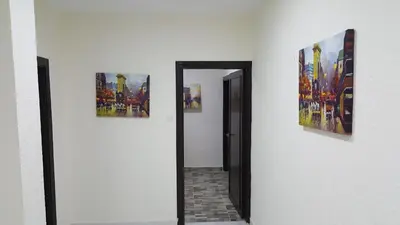a hallway with two pictures on a wall at Darak hotel in Aqaba
