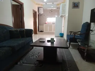 a living room with a couch and a coffee table at Petra Visitors Hotel in Wadi Musa