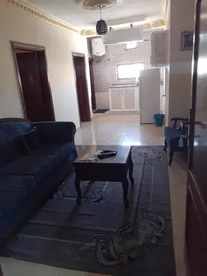 a living room with a couch and a coffee table at Petra Visitors Hotel in Wadi Musa