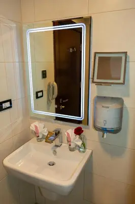 a white sink in a bathroom with a mirror at Petra Boutique Hotel in Wadi Musa
