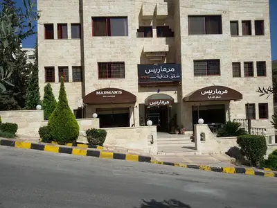 a building with a street in front of it at Marmaris Hotel Apartments in Amman