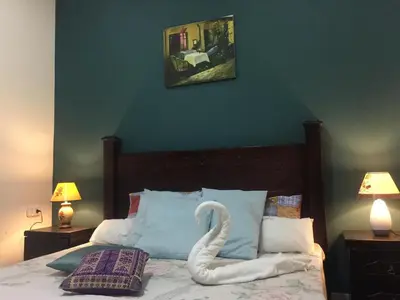 a swan made out of pillows on a bed at Nobel Hotel in Amman