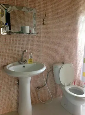 a bathroom with a sink and a toilet at Murshed Motel in Ash Shūnah ash Shamālīyah