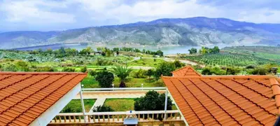 a view from the roof of a house with mountains in the background at Murshed Motel in Ash Shūnah ash Shamālīyah
