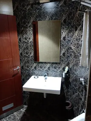 a bathroom with a sink and a mirror at seven7days hotel in Aqaba