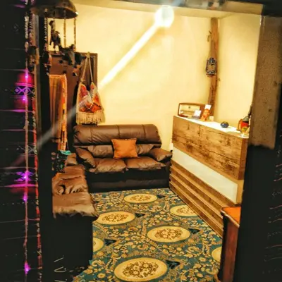 a living room with a couch and a rug at Majido Hotel in Wadi Musa