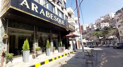 a storefront of a restaurant on a city street at Arabesque Hotel in Amman