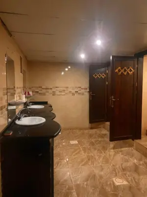a bathroom with two sinks and two stalls at Desert Tree camp&tours in Wadi Rum