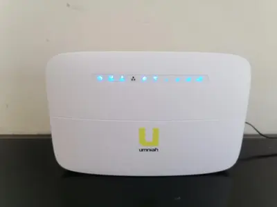 a white router sitting on top of a table at Behind Mecca Mall in Amman