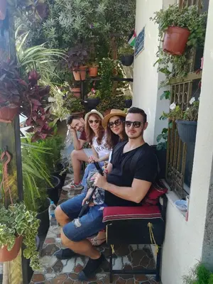 a group of people sitting on a bench at Al Midan Hotel in Amman
