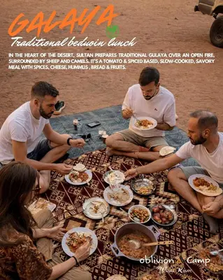 a group of people sitting around a table eating food at Oblivion Camp Wadi Rum in Wadi Rum