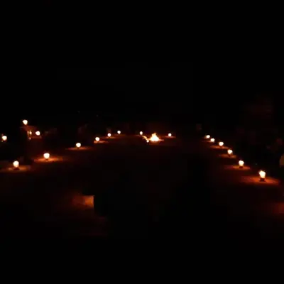 a row of lights on a street at night at Wadi Rum Excursions in Wadi Rum