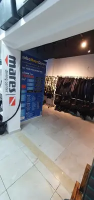 a store with a sign in the middle of a room at Golden Rose Hotel in Aqaba