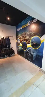 a room with a display of yellow sunglasses on a wall at Golden Rose Hotel in Aqaba