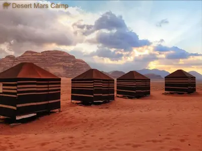 a group of five huts in the desert at Wadi Rum Bright Moon in Wadi Rum