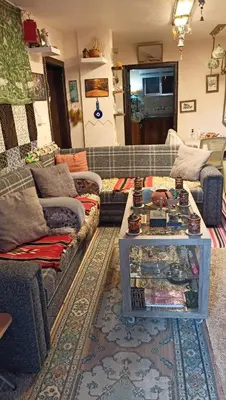 a living room with a couch and a table at Petra Heritage House in Wadi Musa