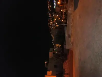 an aerial view of a city at night at Petra Heritage House in Wadi Musa