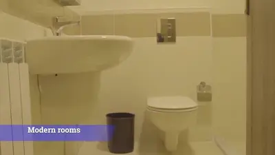 a bathroom with a white toilet and a sink at Al-Mujeb in Kerak