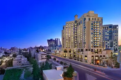 a view of a city with tall buildings and a street at The St. Regis Amman in Amman