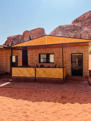 a brick house in the middle of the desert at wadi rum bedouin stars camp in Wadi Rum
