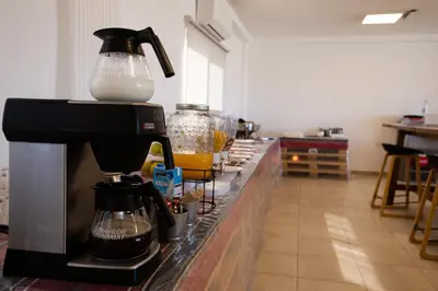 a coffee maker sitting on a counter in a kitchen at Nomads Hotel in Wadi Musa