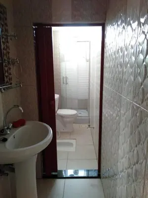 a bathroom with a sink and a toilet and a shower at Wateen Home in Wadi Musa