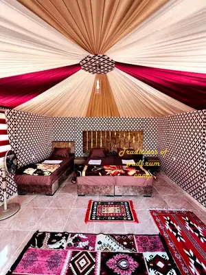 a living room with a red and white ceiling at Traditions of Wadi Rum camp & jeep tour in Wadi Rum