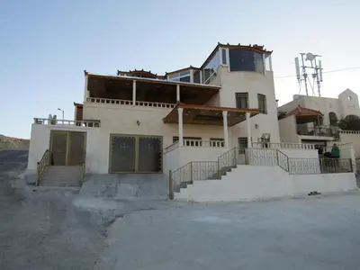 a house with a staircase in front of it at Basant Villa in Wadi Musa