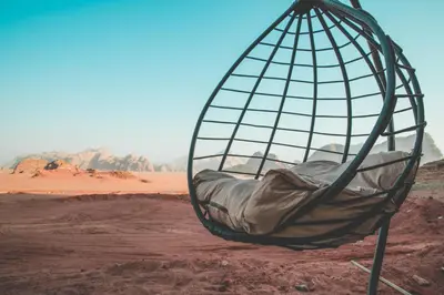 a hammock in the middle of the desert at Zeina Desert Lodge in Wadi Rum