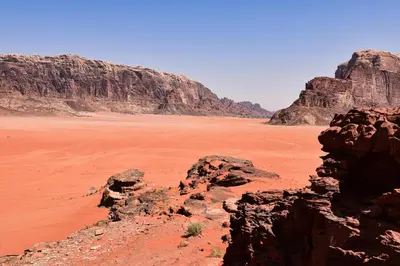 a view of the desert with mountains and rocks at Wadi Rum Bedouin Heart in Wadi Rum