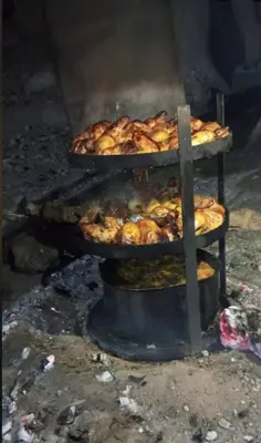 a bunch of food is cooking in an oven at Idris home in Wadi Musa
