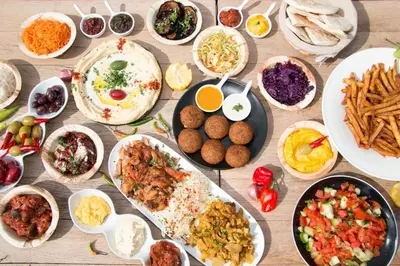 a table topped with lots of different types of food at Idris home in Wadi Musa